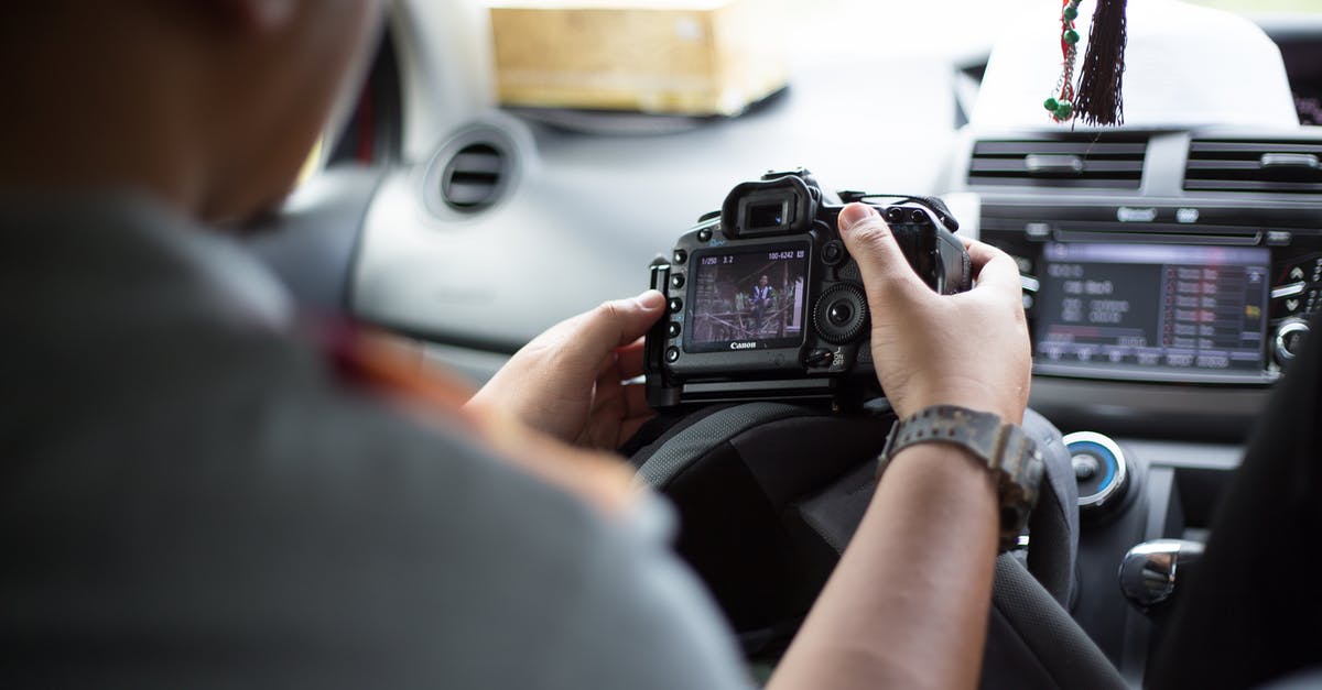 It is legal to have a dashboard camera in the UAE? - Midsection of Man Using Mobile Phone