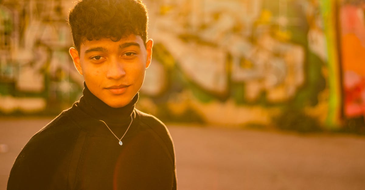 Italian equivalent to French St. Tropez or Spanish Marbella? - Headshot of a Man Wearing a Black Turtleneck