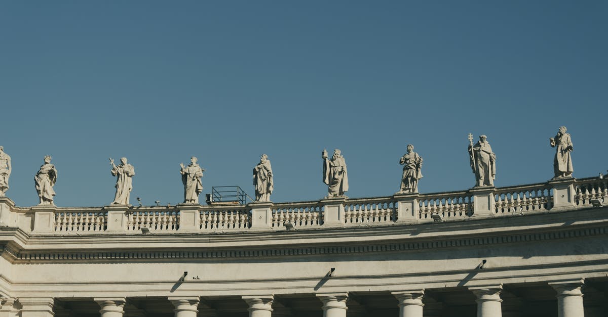 Italian Ricevuta / Travelling outside of Schengen [duplicate] - Stone old sculptures over columns against blue sky