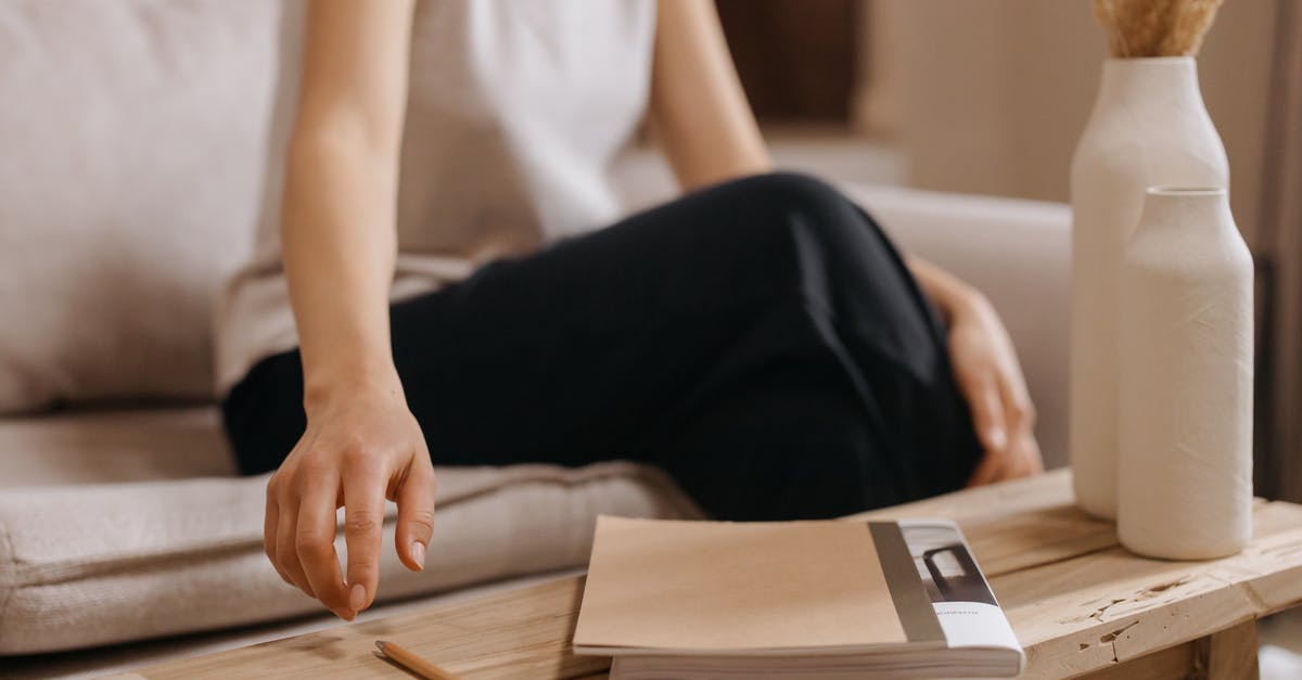 Itinerary changes by inserting Croatia after getting Schengen visa - Woman in White Shirt and Black Pants Sitting on Chair Reading Book