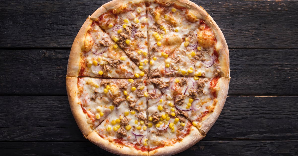 Japanese Corn and Mayo Pizza - Tasty pizza with canned corn grains on wooden surface