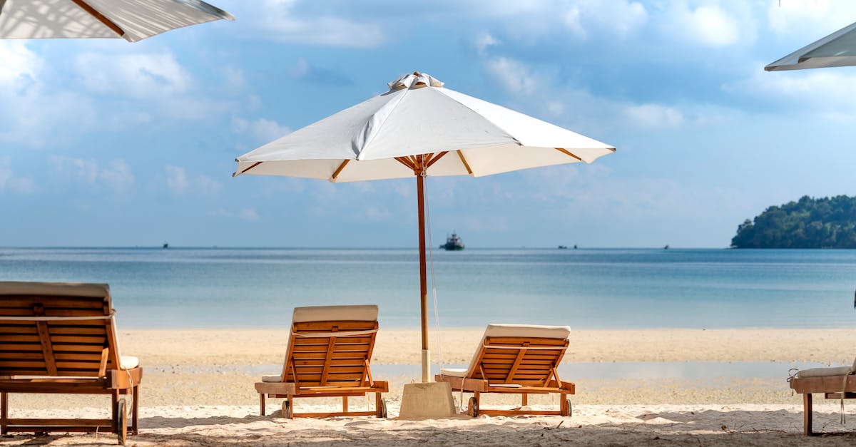Jeju Island (New Natural Wonder of the World) - How to Get There? - Tropical beach with deckchairs and umbrella