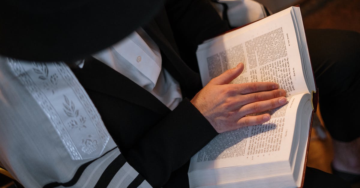 Jewish prayer services in Heathrow Airport - Man Reading Torah