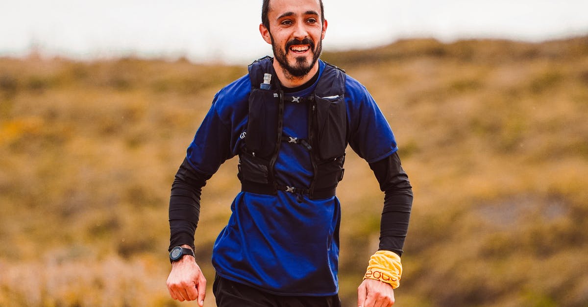 Jogging in Bucharest? - Man in Blue and Black Jacket and Black Pants