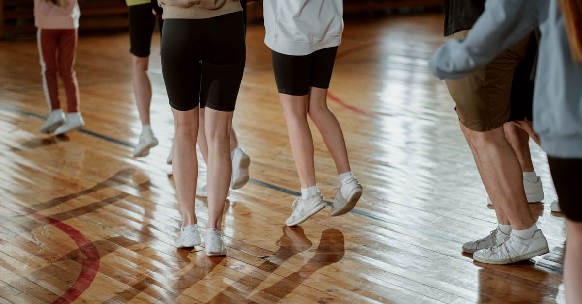 Jogging in Budapest without my passport - Children Wearing White Rubber Shoes Jogging on a Wooden Floor