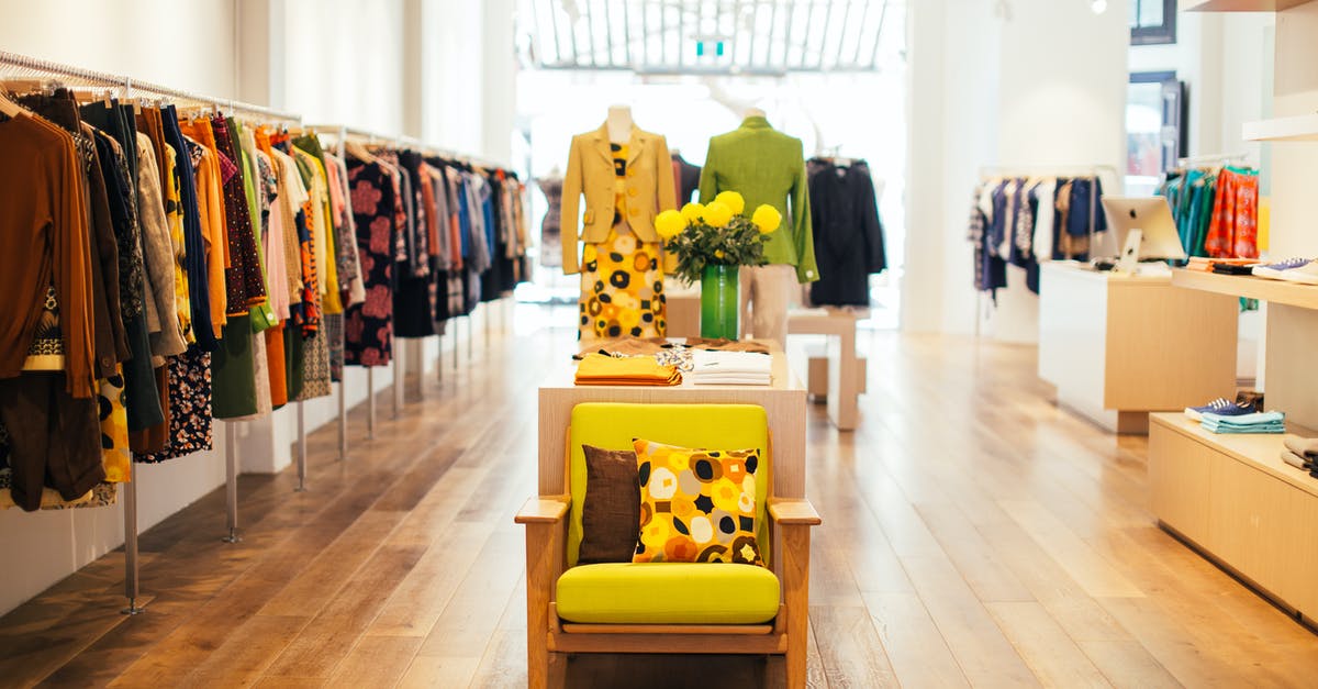 JR Pass inside Tokyo - Interior of modern fashion store with stylish colorful clothes handing on rack in daytime