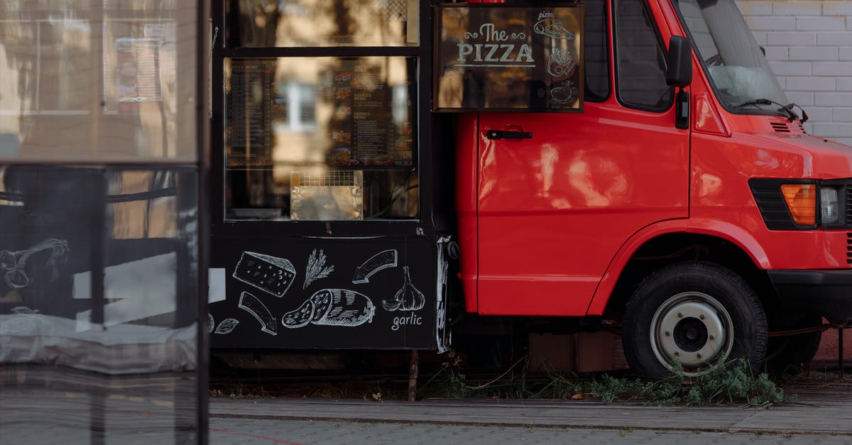 Keflavik car hire shuttle bus service timetable - Red and Black Van on Gray Concrete Road