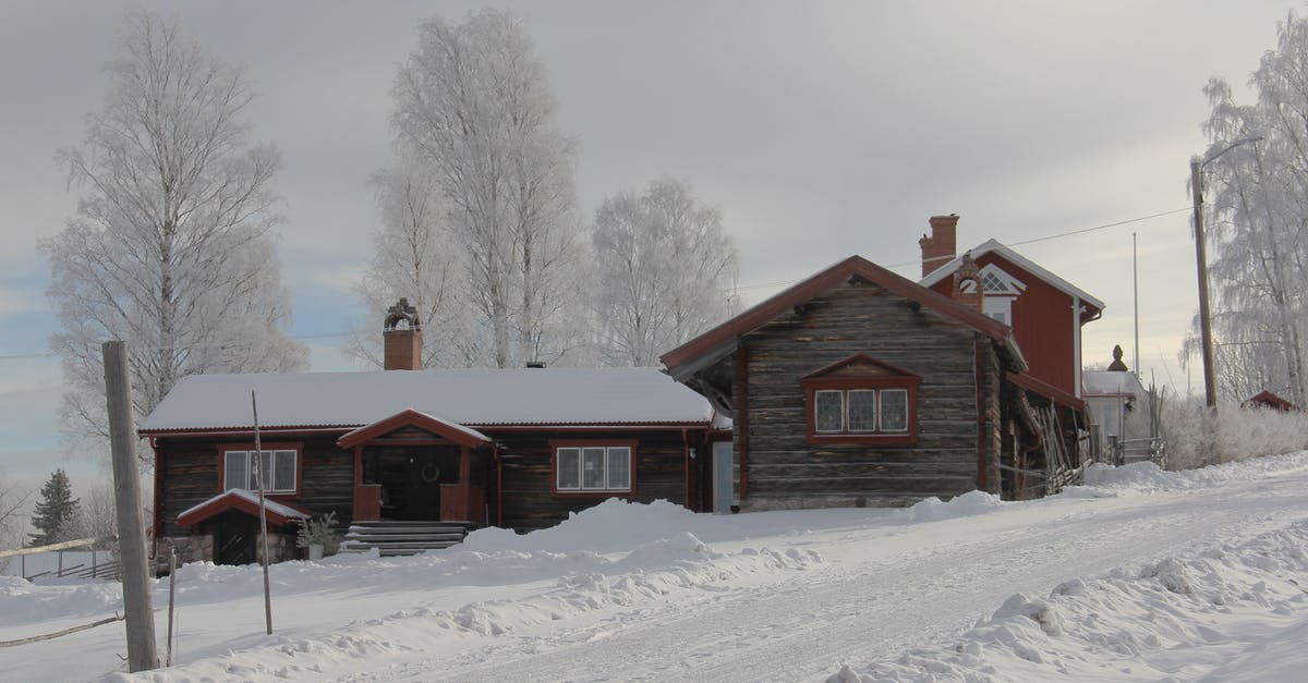 Kenyan citizen travelling to Sweden - Brown Concrete House Near White Tree