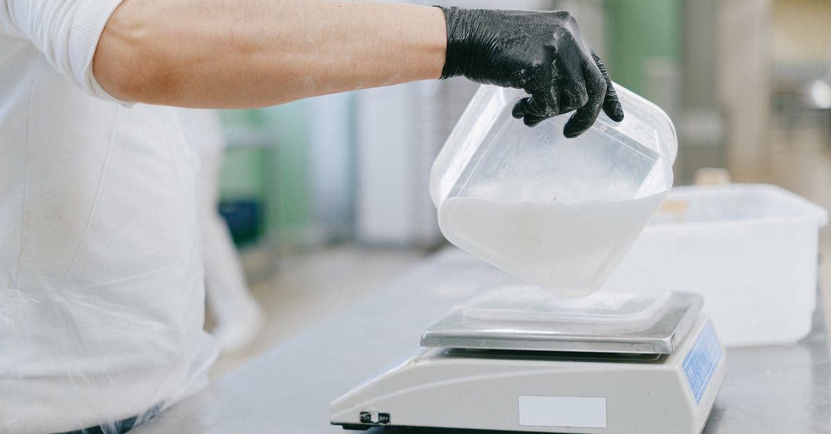 KLM carry-on weighing precedent? - Person Pouring an Ingredient from a Plastic Container to a Weighing Scale