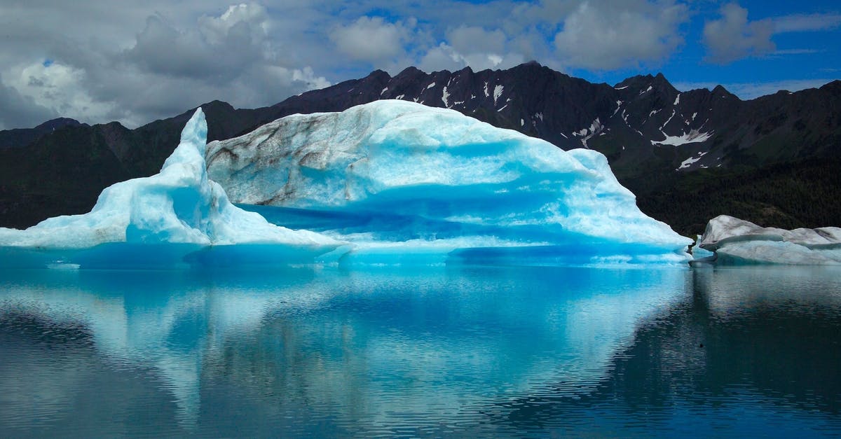 Kuwaiti Travelling to Alaska - Scenic View of Frozen Lake Against Blue Sky