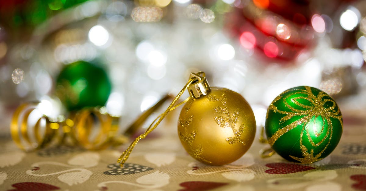 LA Universal Studios in Christmas [closed] - Gold and Green Baubles on White Textile