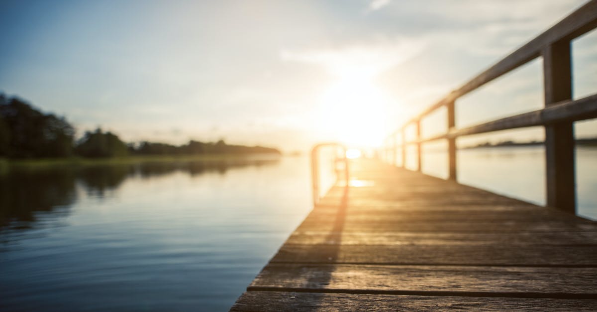 Lake Victoria Region Travel [closed] - Low Angle Photography of Brown Wooden Dock at Golden House