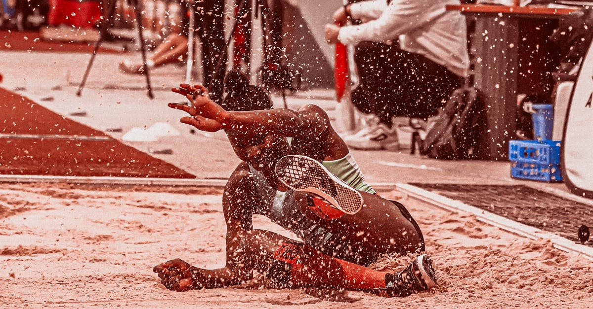 Landing midnightish in Russia: Am I stuck? - Woman Landing on Sand After Doing Long Jump 