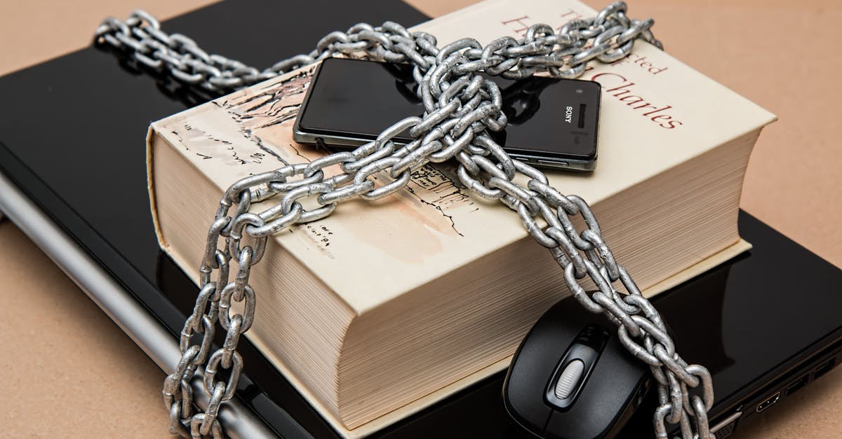 Laptop at security checkpoints - Black Android Smartphone on Top of White Book