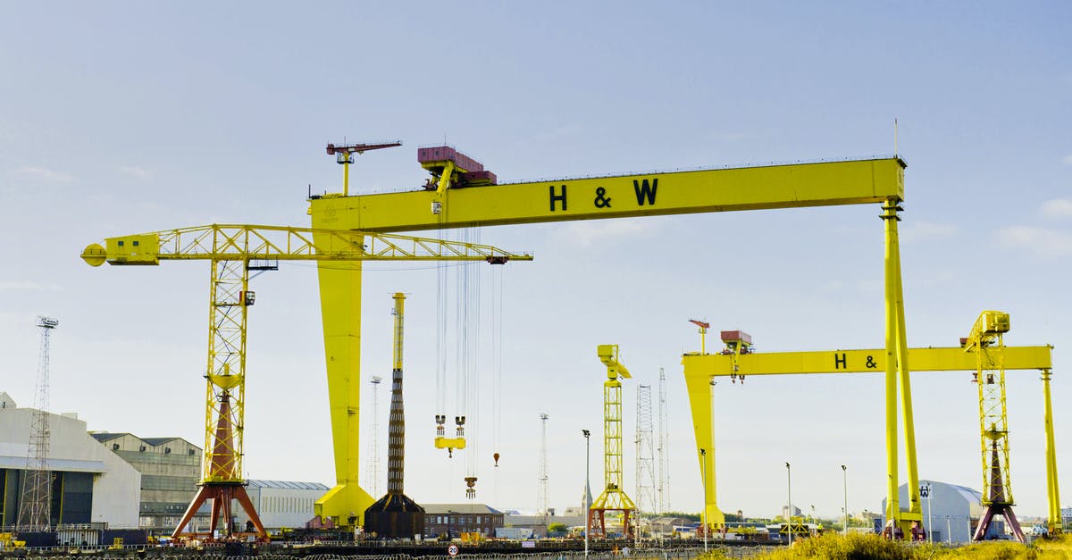 Large tech allowed on Intl. flight? [duplicate] - Yellow Cargo Ship Crane