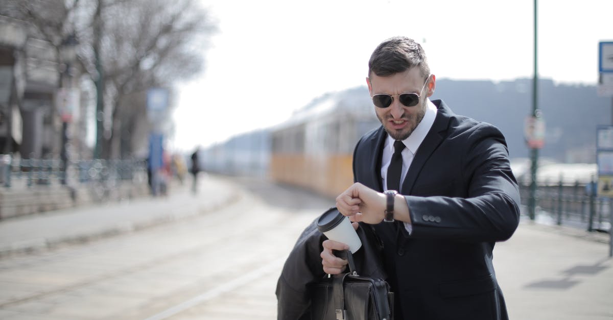 Late running Eurostar service from Brussels [duplicate] - Man in Black Suit Jacket Holding Black Leather Bag