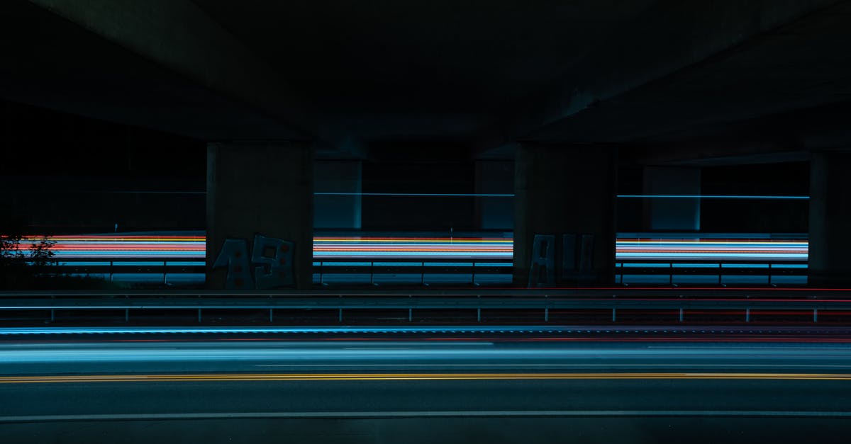 Layover at Charles-de-Gaulle airport in March-April 2021 - Man in Black Jacket Standing on Gray Concrete Bridge