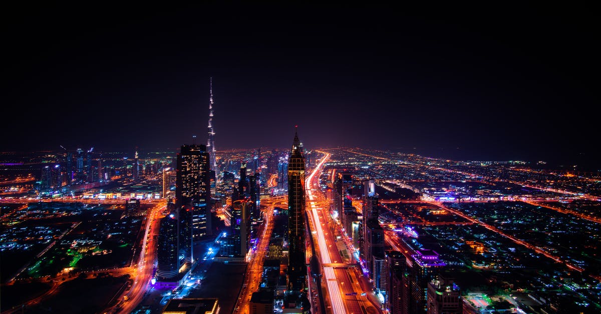 Layover: Dubai or Doha - High Rise Buildings during Night Time Photo