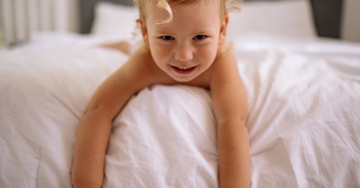 Layover in CDG Enough Time for Customs? - Topless Baby Lying on Bed