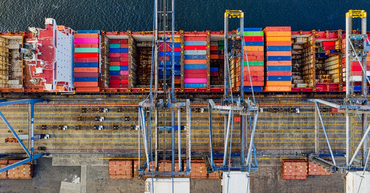 Layover in Mexico, clear customs on first port of entry? - Top-view Photography of Cargo Ship With Intermodal Containers