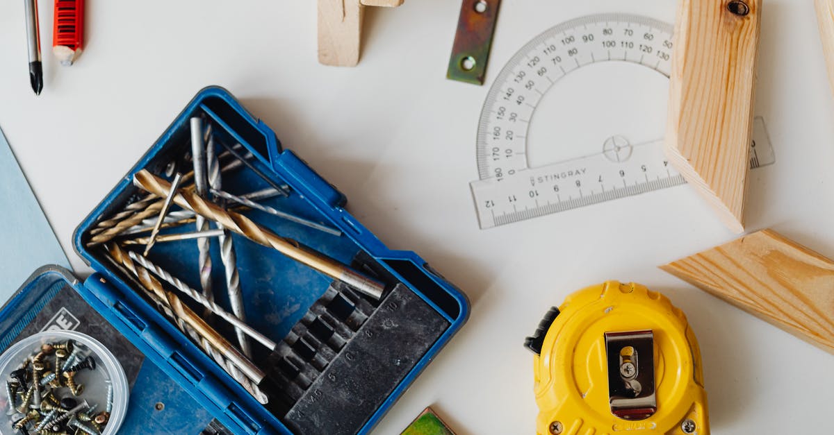 “Overstaying” for a bit? - Close-Up Photo of a Measuring Tape Near a Protractor