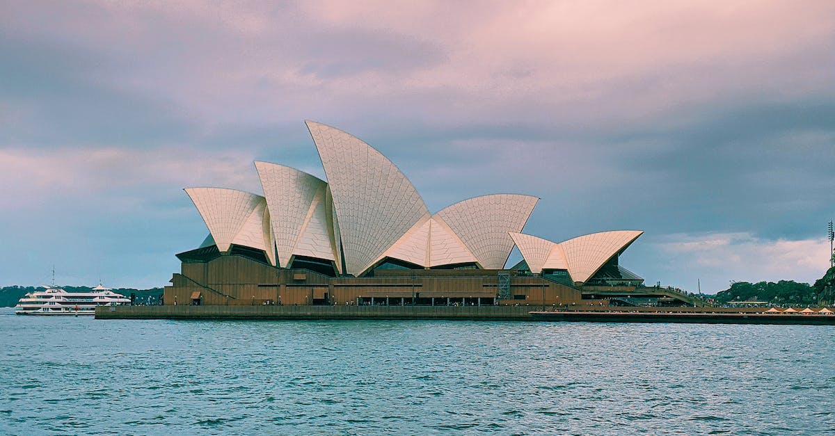 Learn to sail in Sydney? - Modern building of  Sydney Opera House during sunset