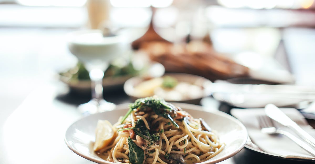 Leaving food on a plate in Russia - Pasta Dish on White Ceramic Plate