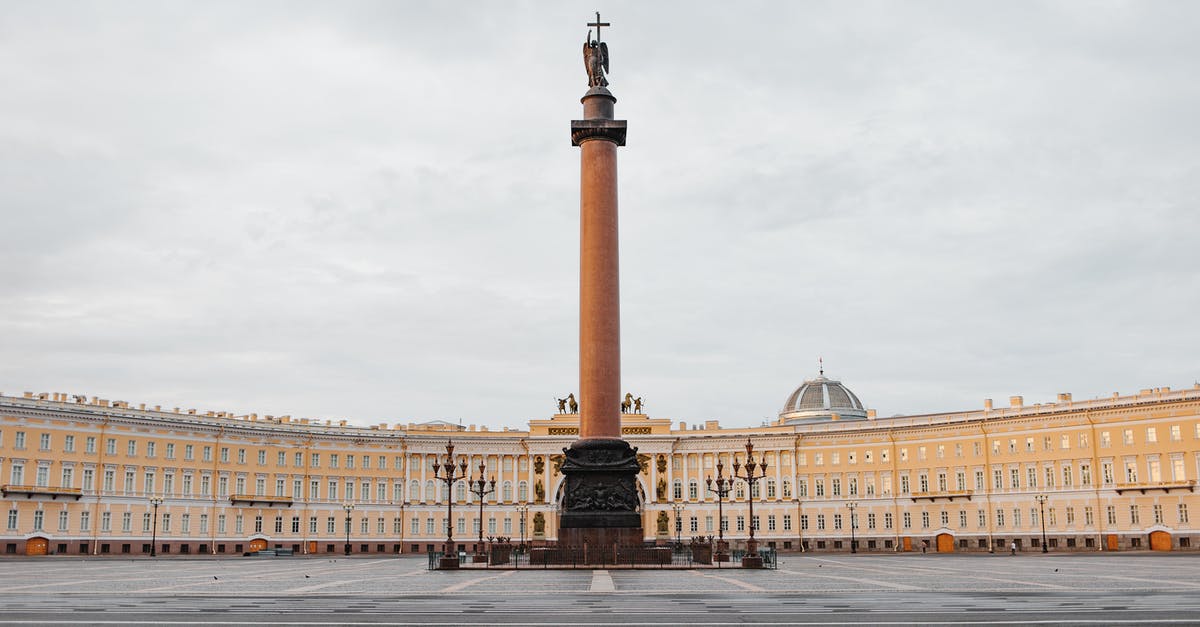 Leaving Russia with Schengen Visa - Beige Concrete Building Under White Clouds