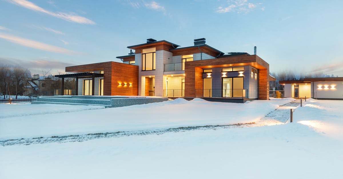 Leaving Schengen area - Illuminated cottage house in winter countryside