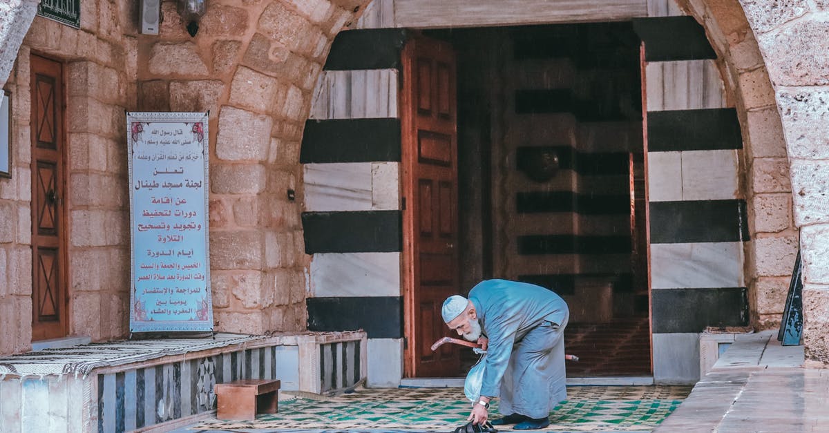 Leaving Schengen region to reset 90 days [duplicate] - Man Leaving Shoes by Mosque Entrance