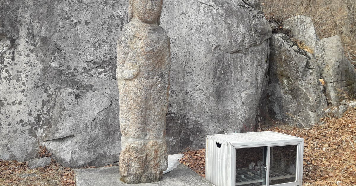 Left UK without passing through Immigration, why? - Old Cabinet Left Next to Stone Statue