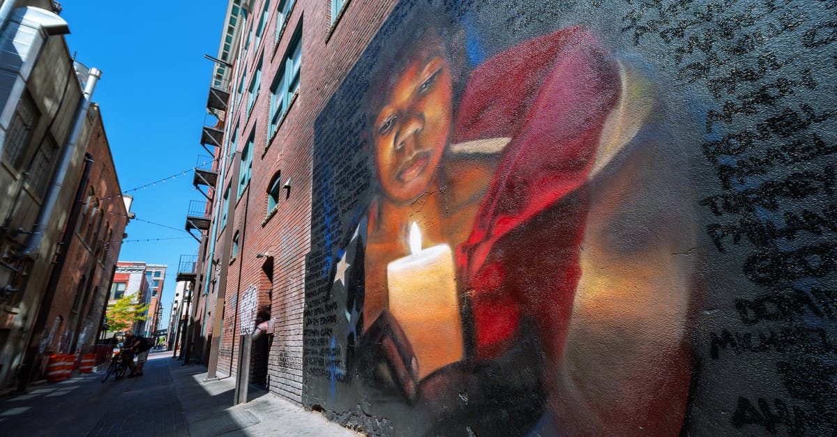 Left/right right of turn on an intersection in USA - Graffiti on brick wall on street