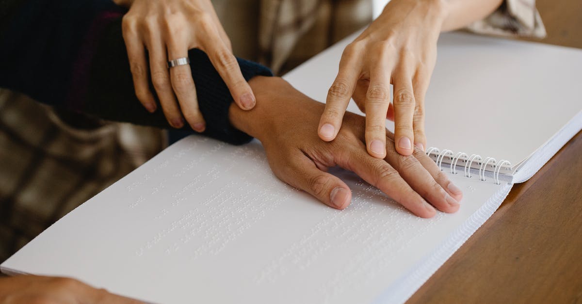 Letter of support - Canada Visa - Blind person reading braille text