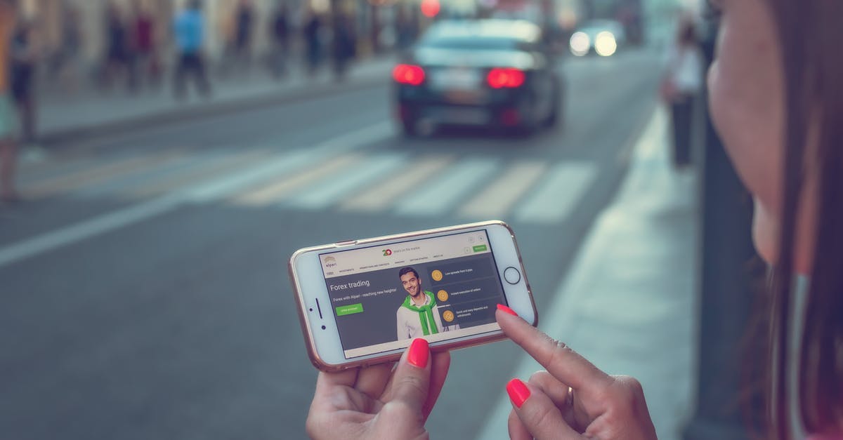 limitations of cash while traveling - Woman Using Smartphone