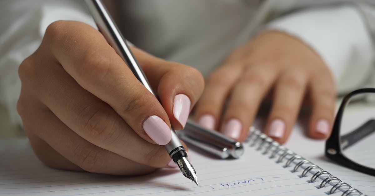 List of countries visited on DS-160 - Woman in White Long Sleeved Shirt Holding a Pen Writing on a Paper