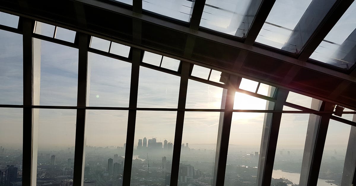 London airport commuting - Clear Glass Window Lot during Golden Hour