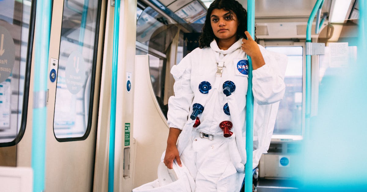 London to Glasgow by train with stopovers - Woman In An Astronaut Costume In A Train