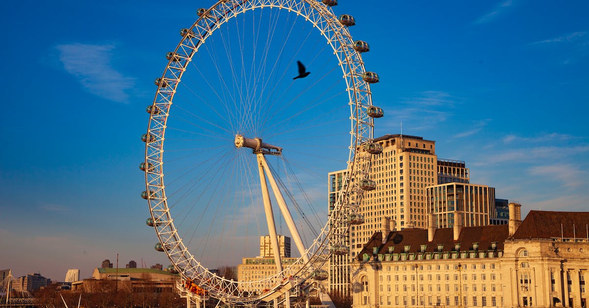 London to Lisbon without flying? - White Ferris Wheel Near Brown Concrete Building