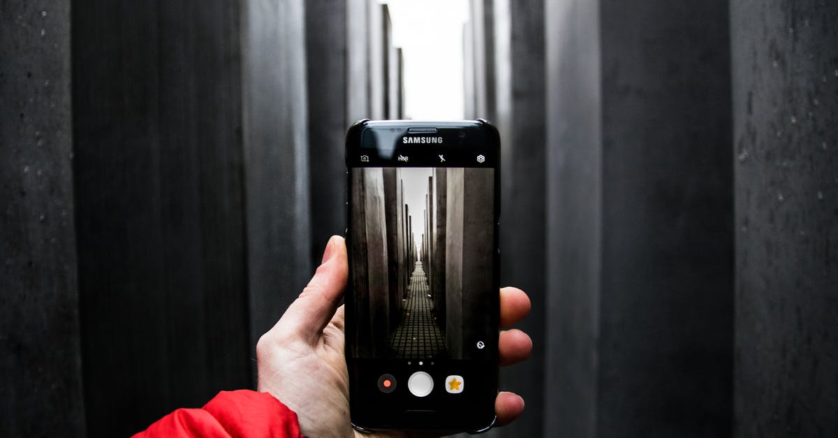 London-Berlin or Rome-Berlin? [closed] - Image of the Holocaust Memorial in Berlin on a Smartphone