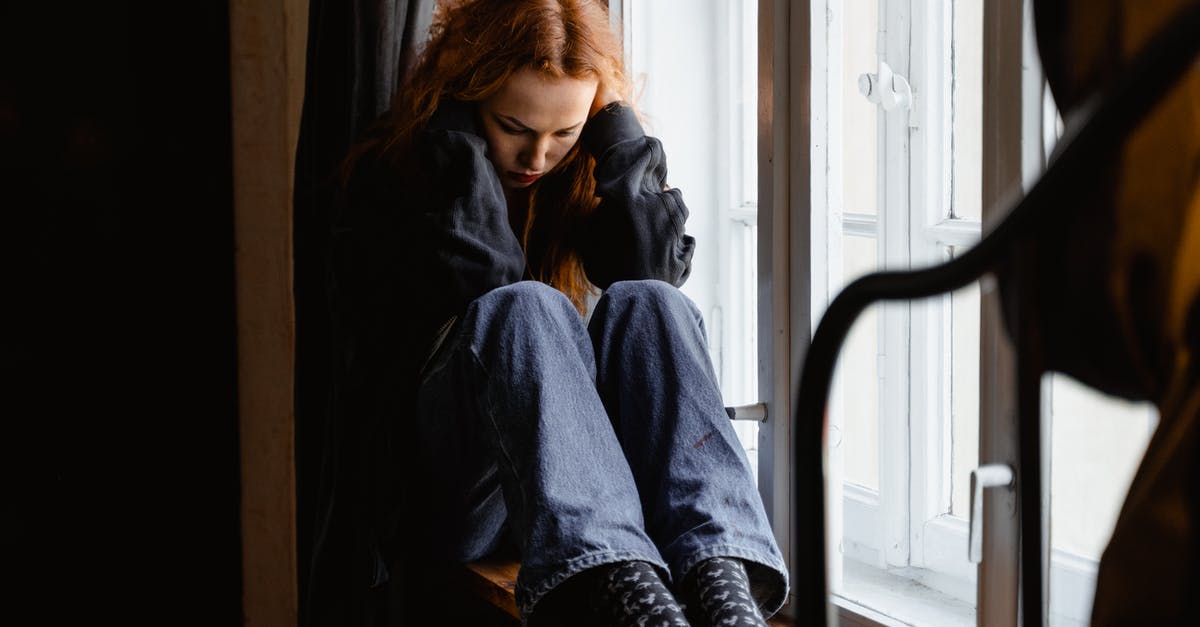 Lone traveler frustration [closed] - Depressed Woman Sitting by the Window