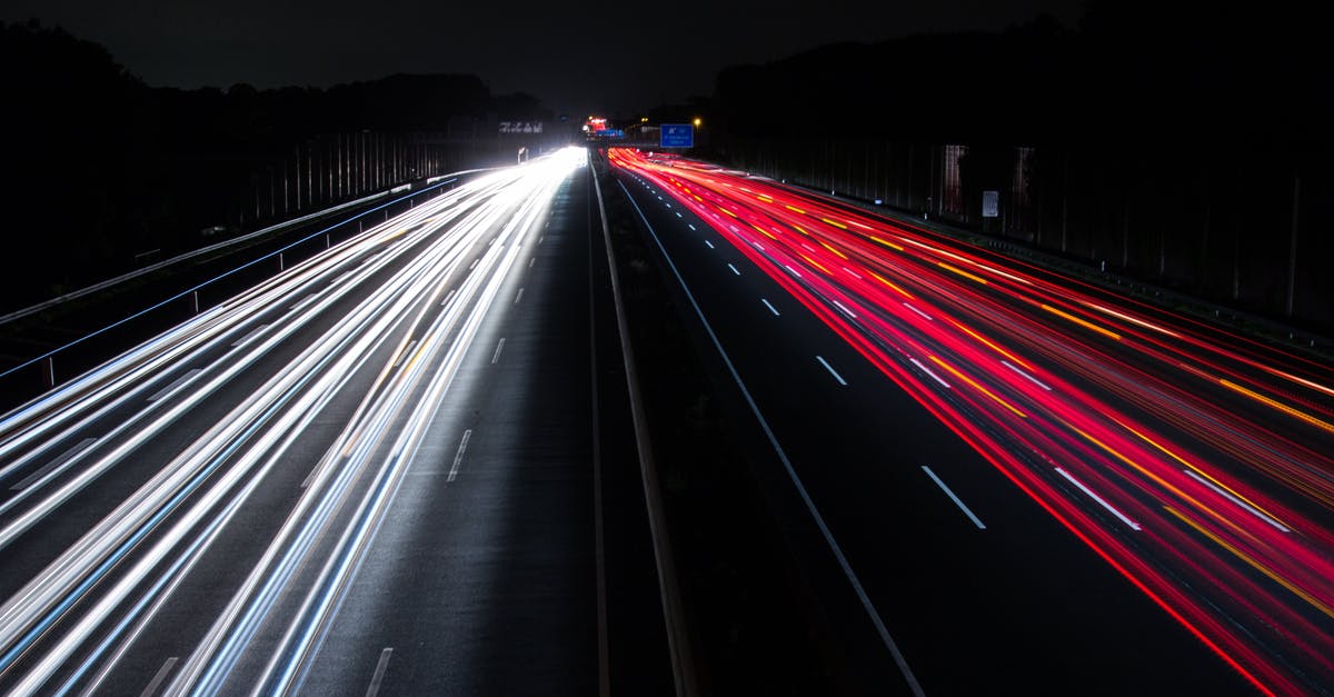 Long Layover (20h) in Reykjavik (Iceland), visit city? - Light Trails on Highway at Night