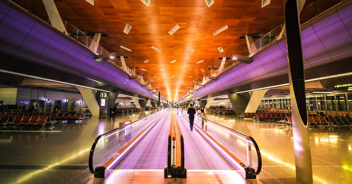 Long layover at Copenhagen Airport (CPH) - Man Near Escalator