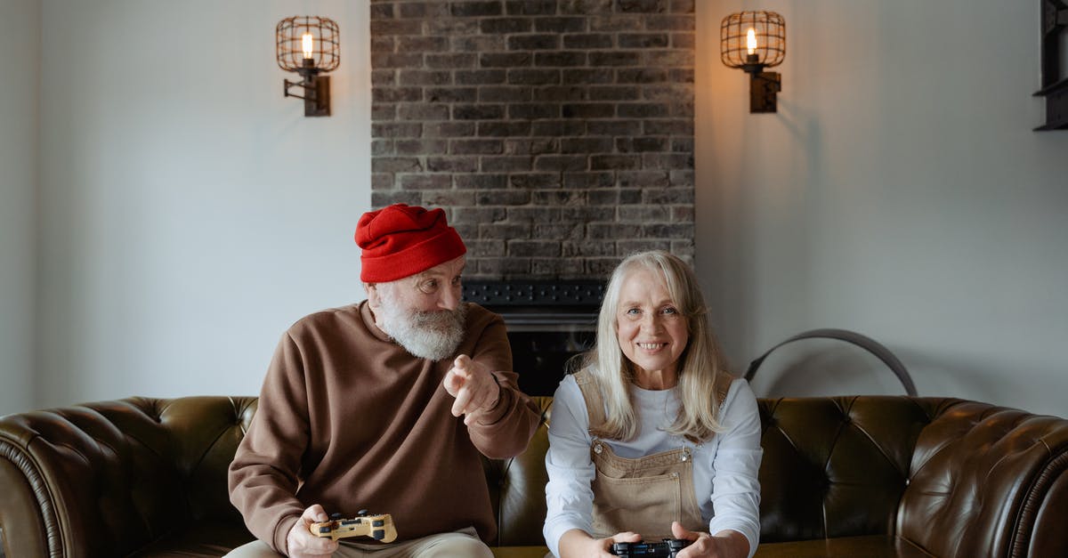 Longer EU stay for retired couple - Man and Woman Playing Video Games