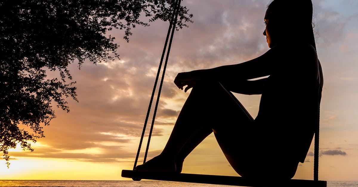 Looking for a sunset spot in Porto, Portugal - Silhouette of Woman on Swing during Golden Hour