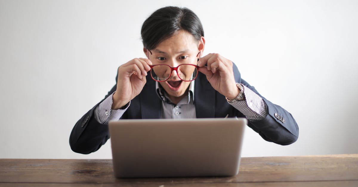 Looking for information on Nachi-no-Hi Matsuri 14 july - Amazed formal male looking at laptop screen