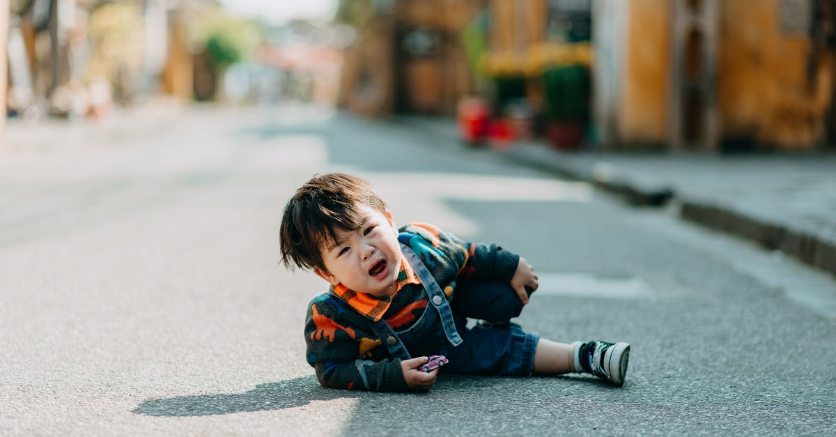 Looking for micro breweries in the Tokyo area - Crying Asian boy lying on road