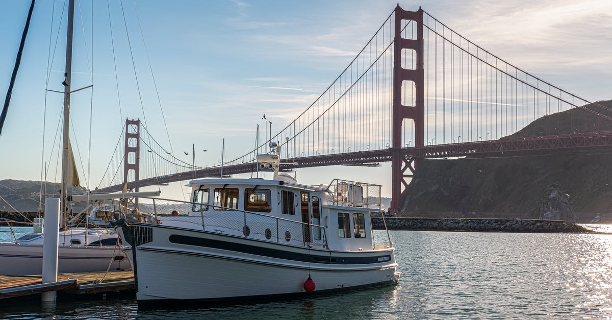 Lost european passports and visas in California - White and Black Boat on Sea Near Bridge Under Blue Sky