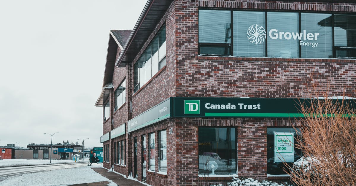 Lost my canada refusal letter [duplicate] - Urban building facade against snowy pavement in wintertime