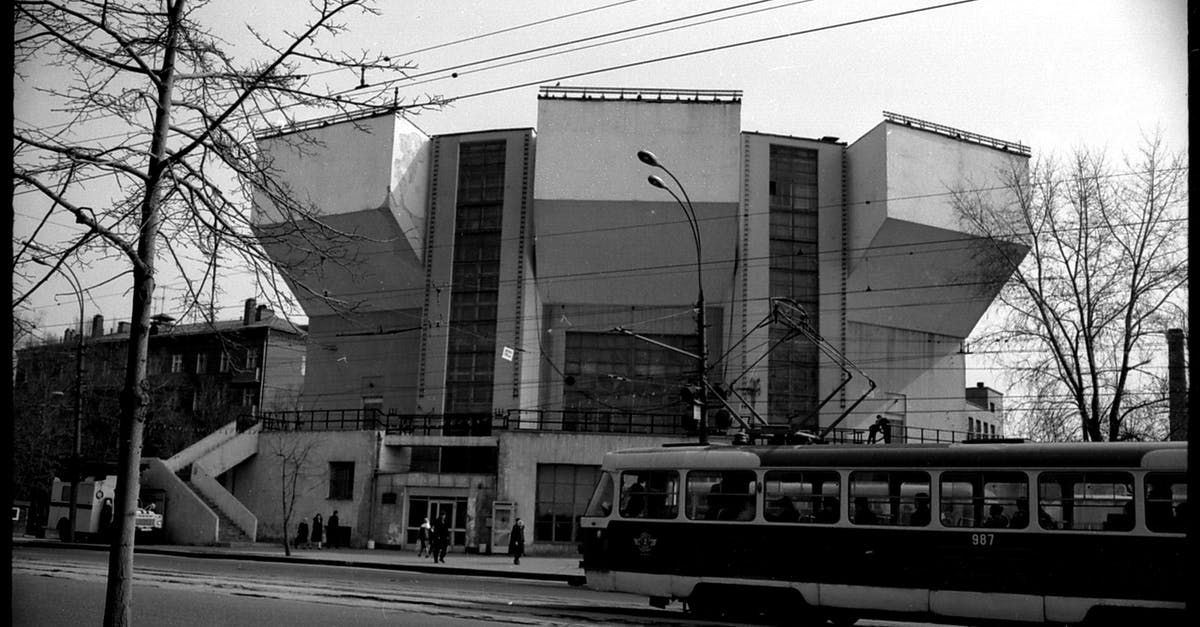 Lost property on Portuguese trains - Black and white of postmodernist building in geometric shapes and tramway station in cold city