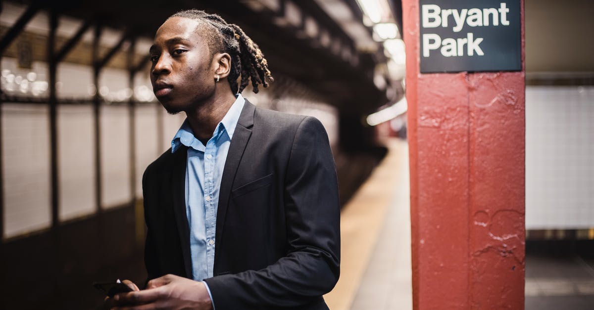 Manhattan subway for the claustrophobic - Serious young male waiting for train in New York underground